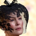 The Real Reason Behind Rosamund Pike’s Veil on the Golden Globes Red Carpet