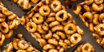 A pile of cereal bars on a white plate.