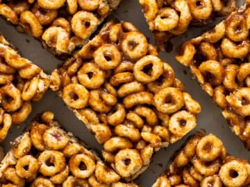 A pile of cereal bars on a white plate.