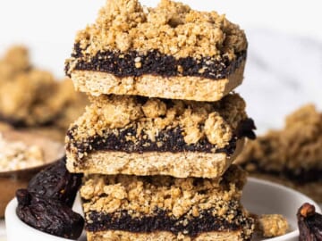 A stack of fig bars on a plate.