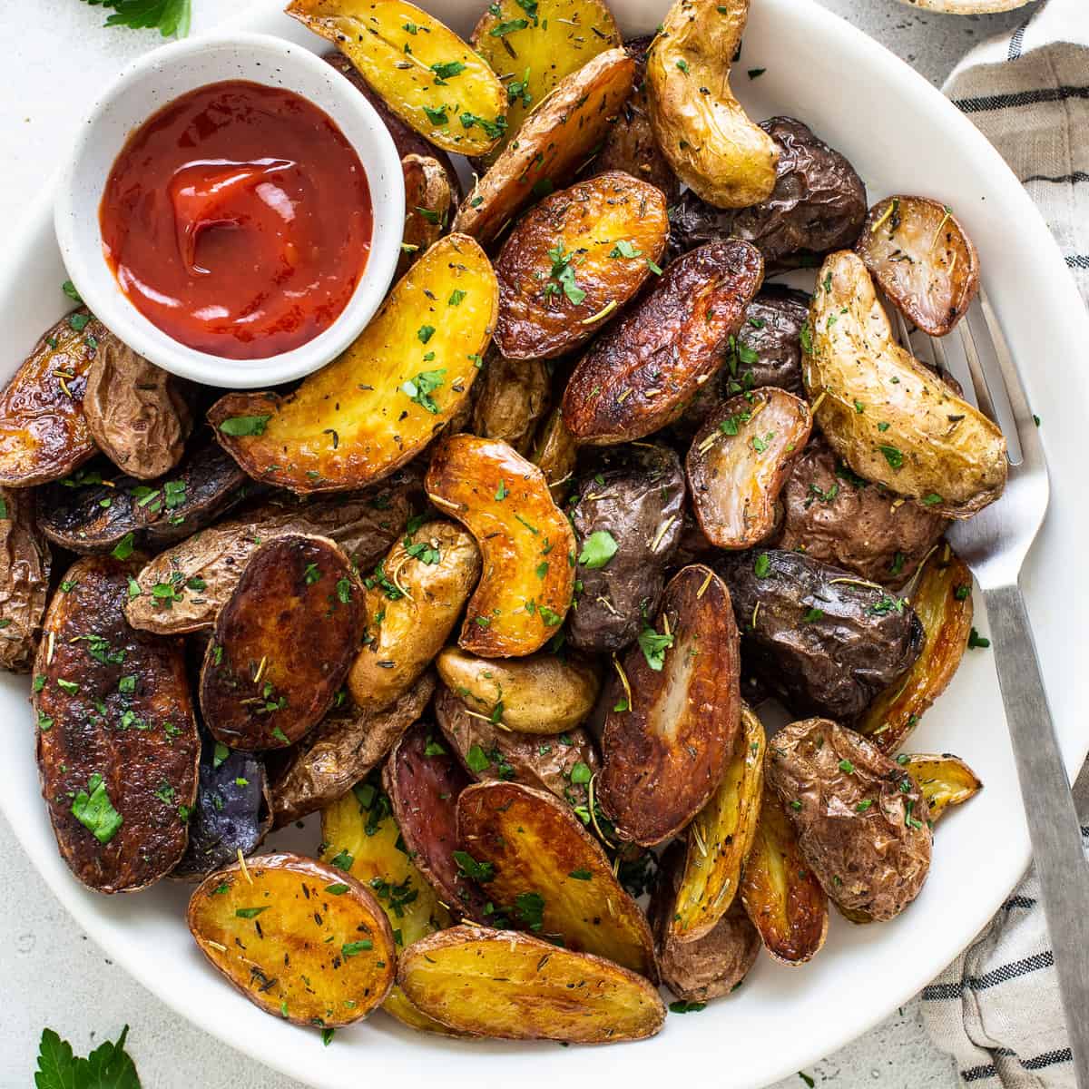 bowl of fingerling potatoes and ketchup.