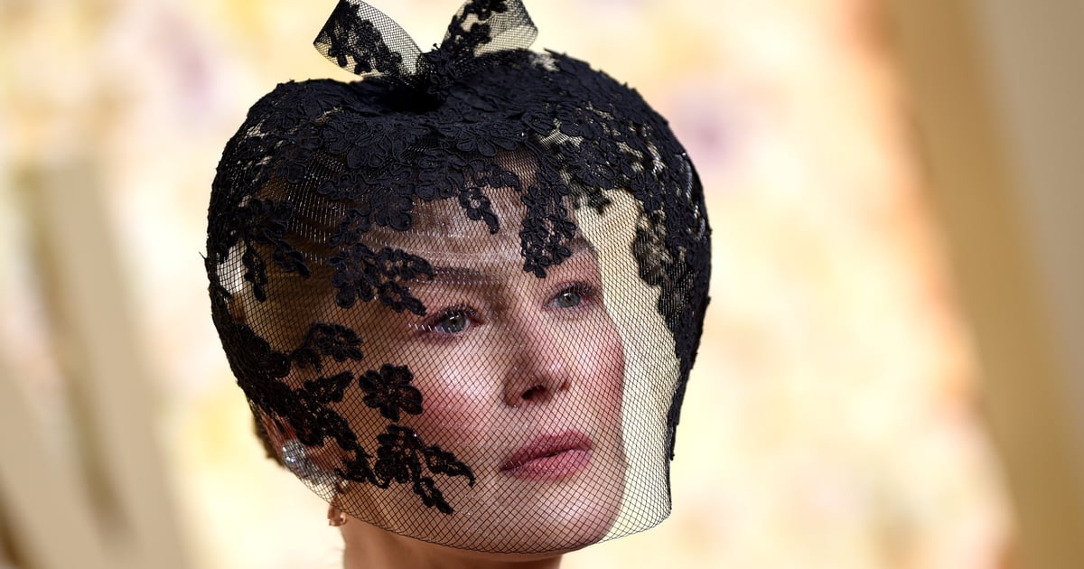 The Real Reason Behind Rosamund Pike’s Veil on the Golden Globes Red Carpet