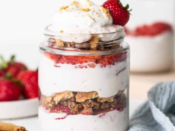 Strawberry granola parfait in a mason jar.