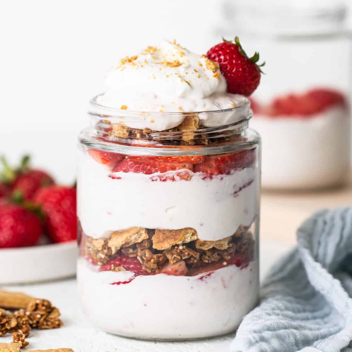 Strawberry granola parfait in a mason jar.