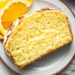 A slice of orange pound cake on a plate.