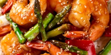 Stir fry shrimp and vegetables with rice on a plate