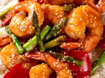 Stir fry shrimp and vegetables with rice on a plate