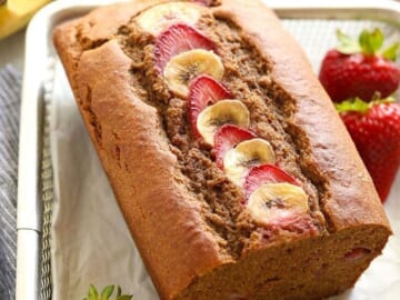 Strawberry banana bread with strawberries and bananas.